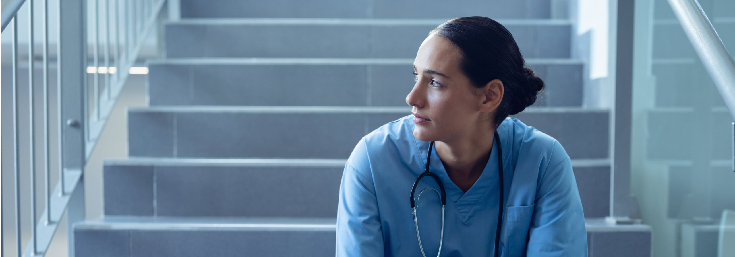 NHS staff burnt out sitting inside a healthcare organisation