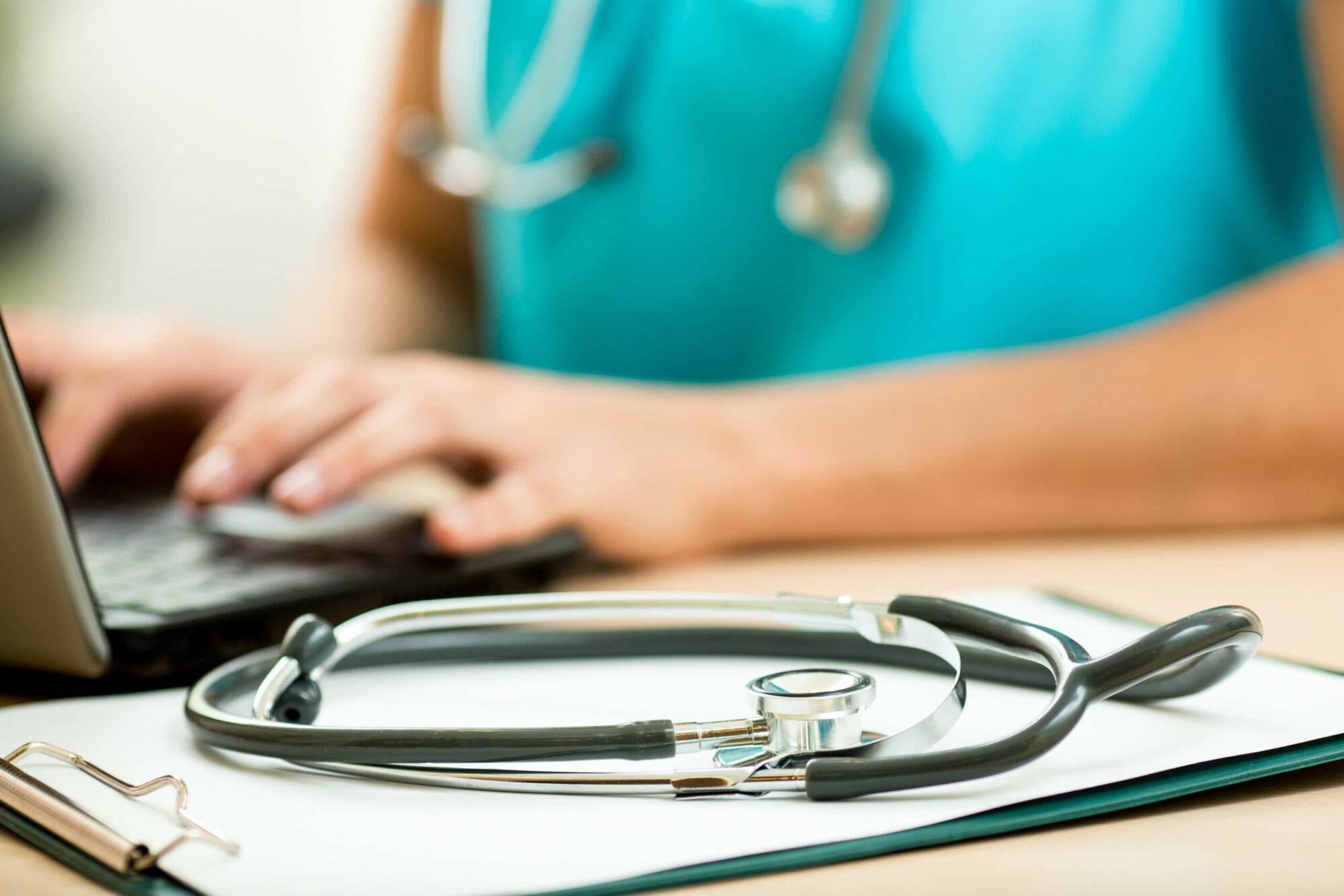 NHS clinician using software for healthcare organisations
