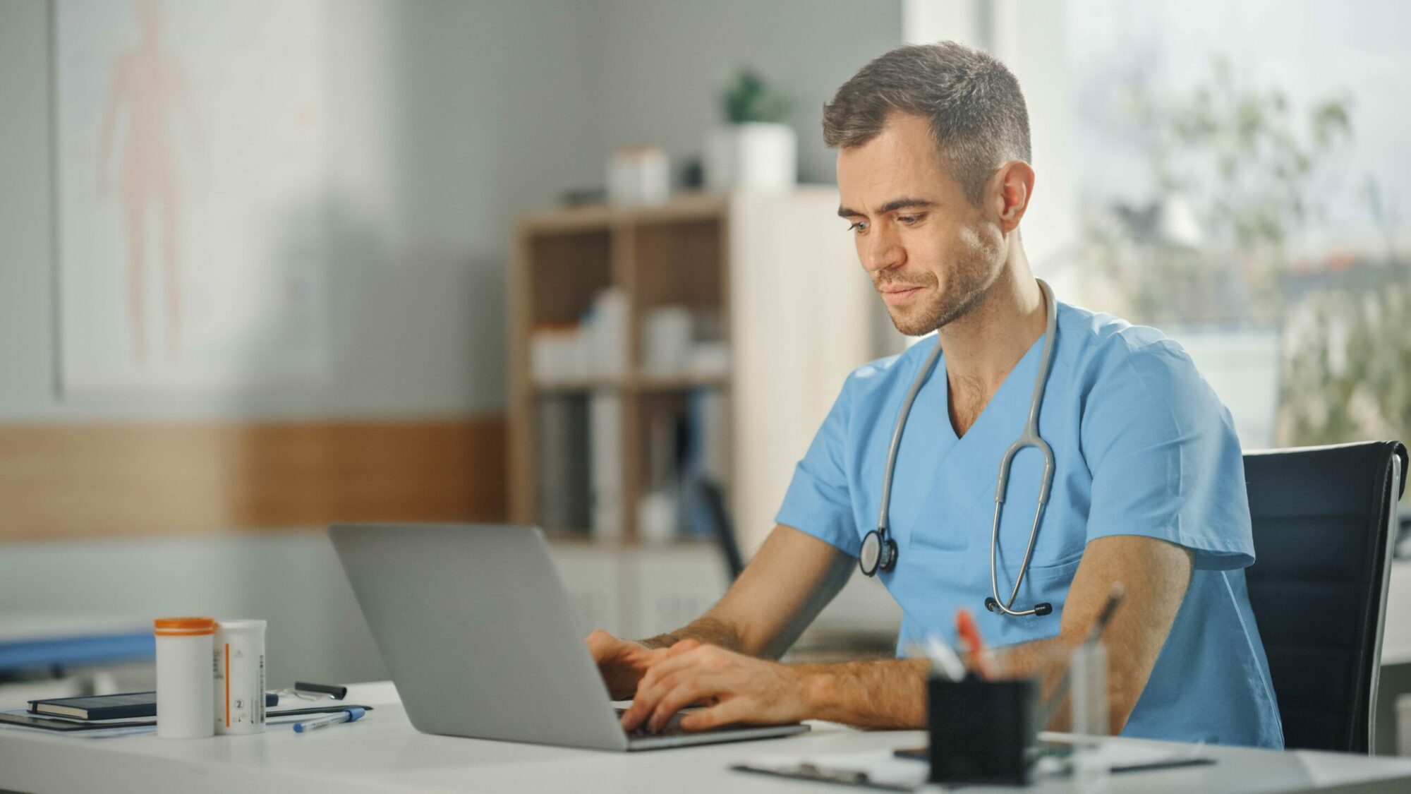 Clinicians using software for healthcare.