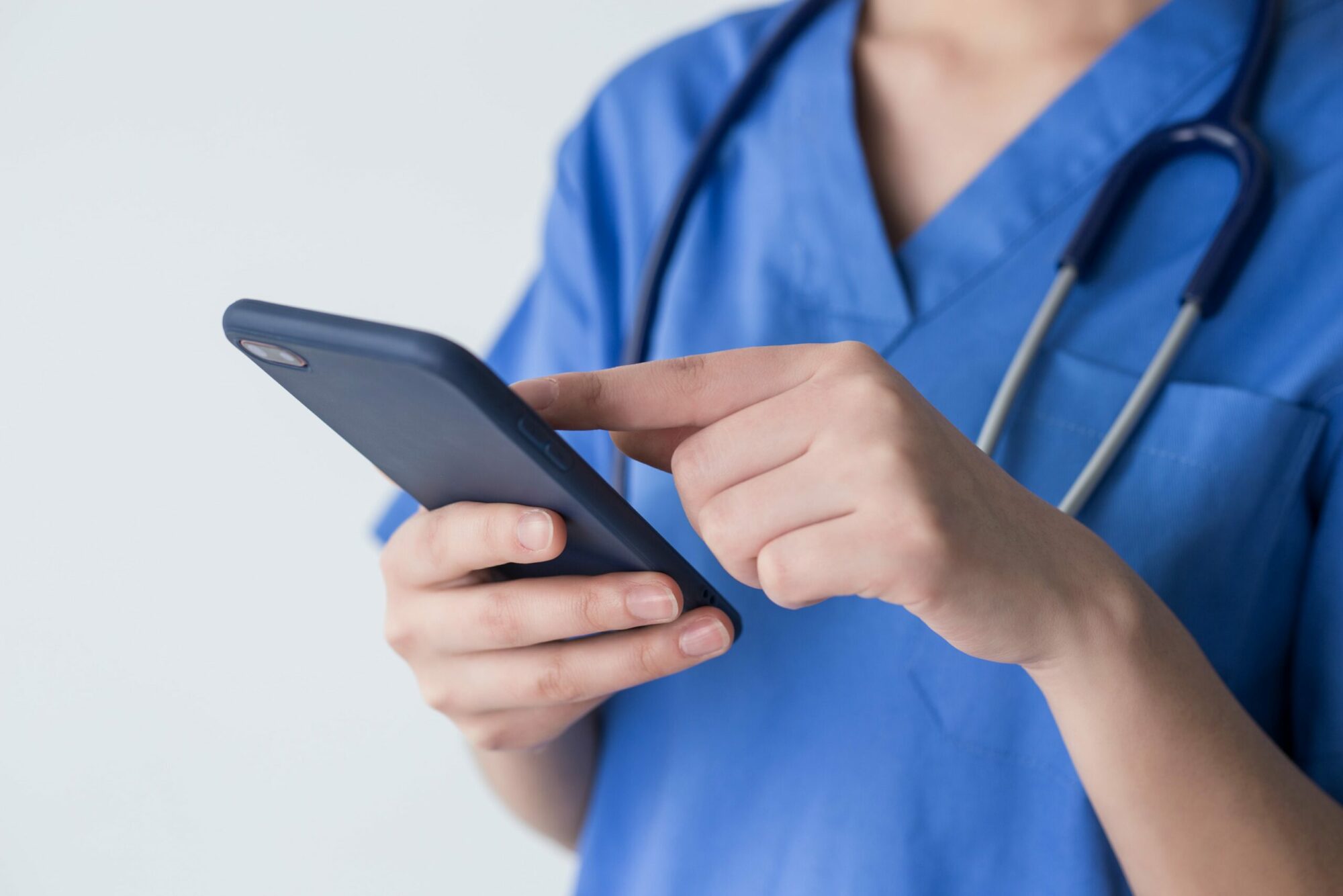 NHS worker using healthcare app solution
