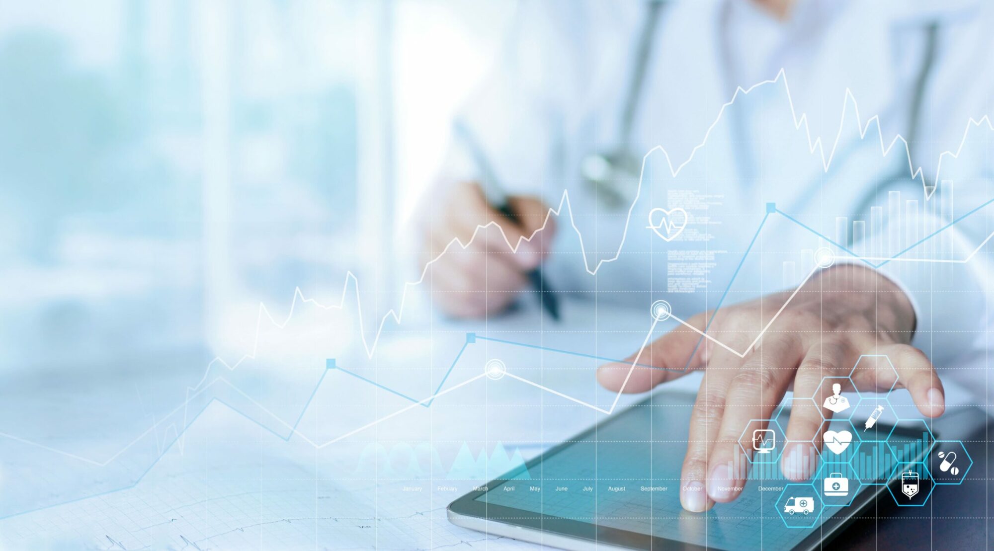 NHS worker using healthcare software with data imagery